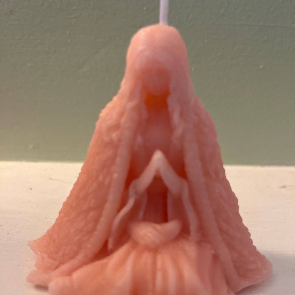 Praying goddess candle